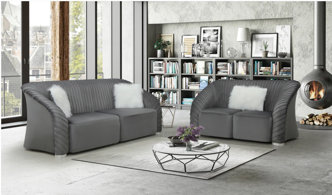 Modern living room with gray luxurious singapore sofa set , a coffee table, and bookshelf.