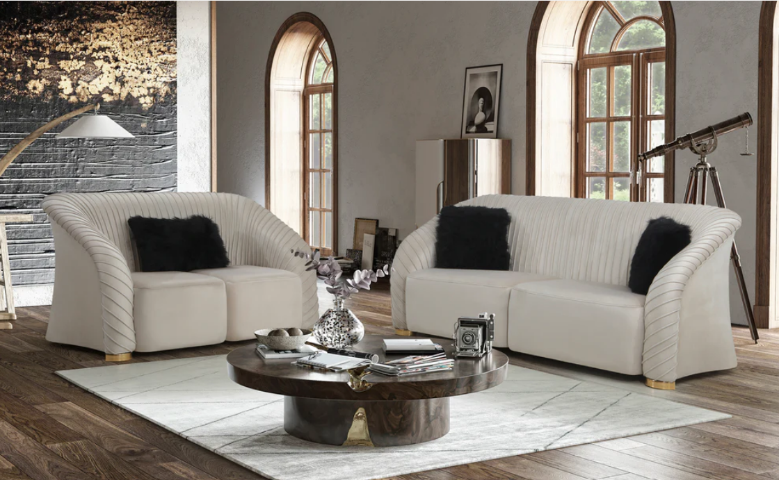 Modern living room with the Singapore luxurious 2-seater sofa sets, a wooden coffee table, and decorative items.